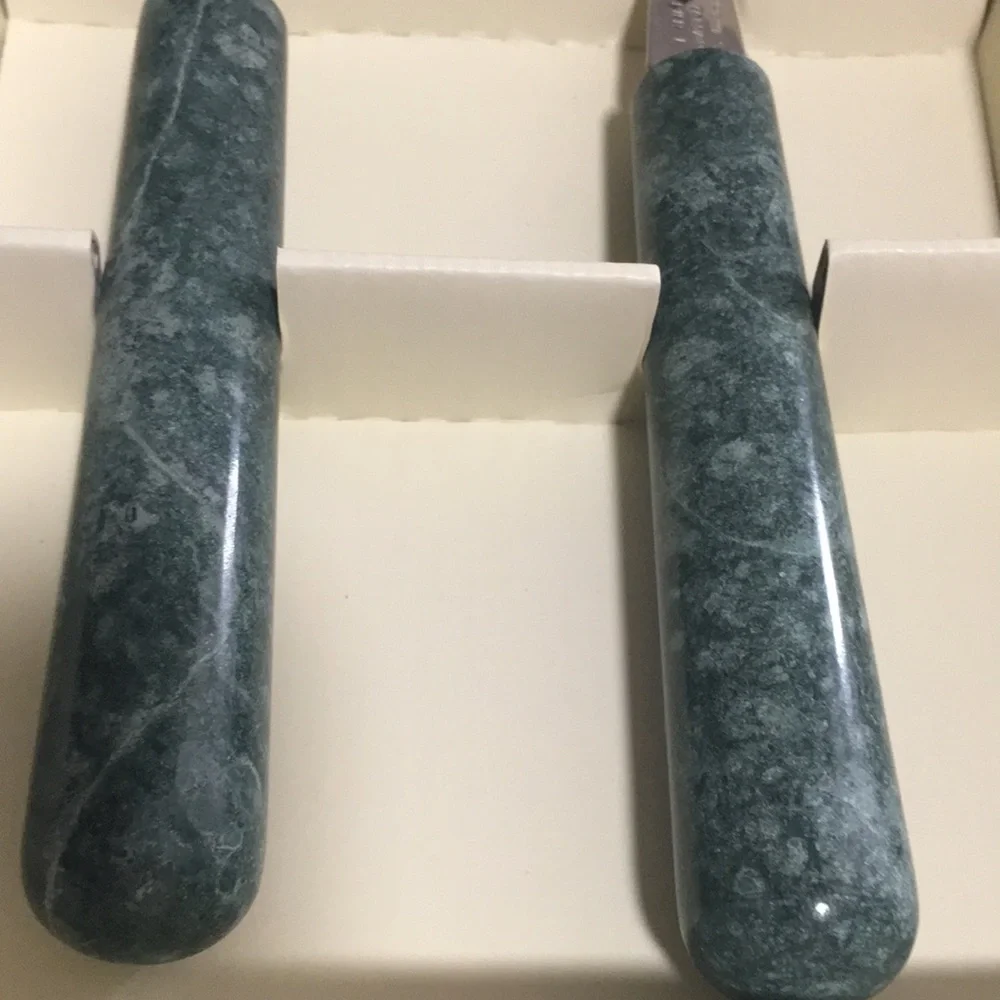 Pier 1 stainless steel cheese knife set with green marble handle.